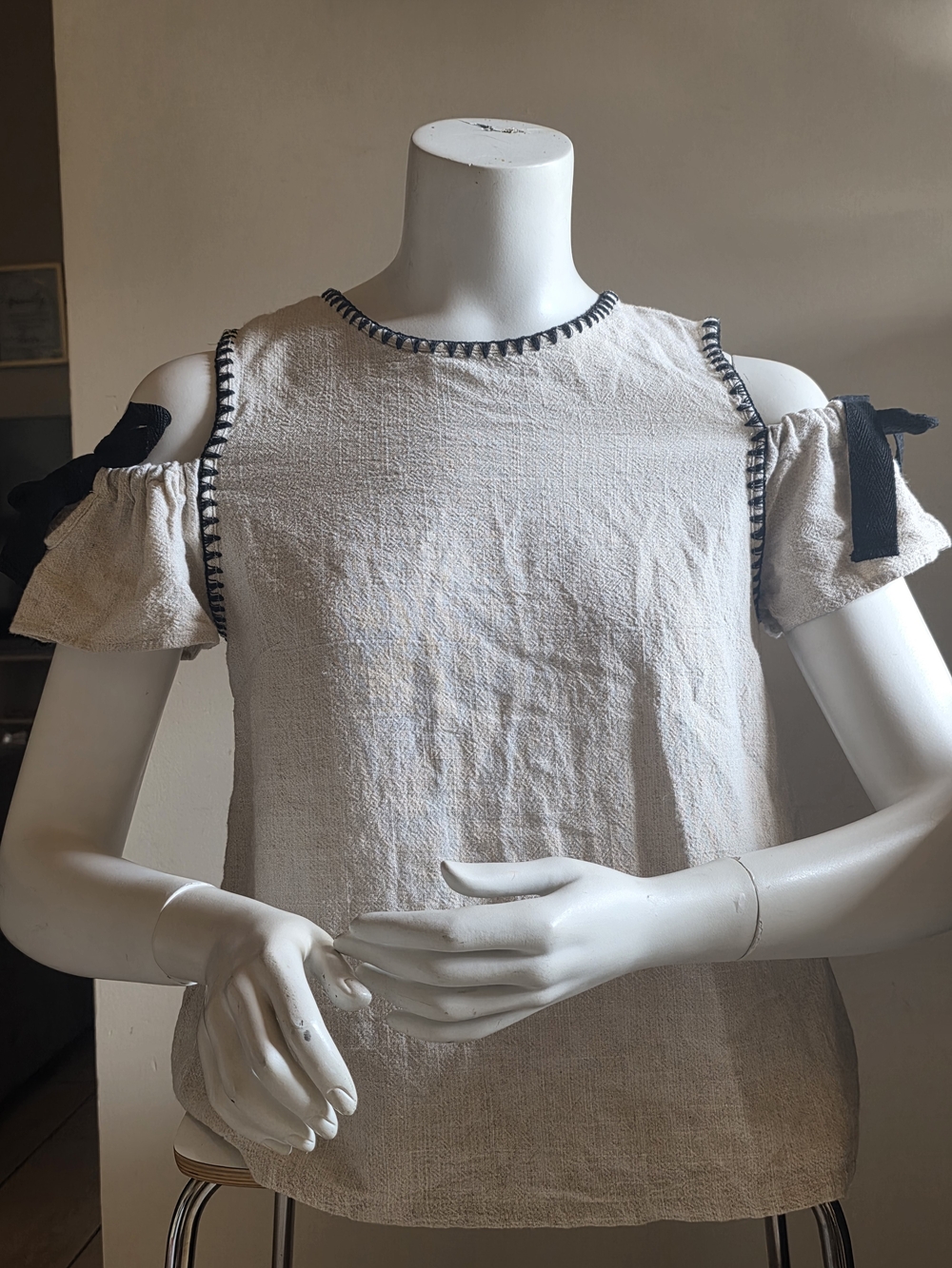 Moon River Cream Cold-Shoulder Top with Black Trim and Bow (Size S)